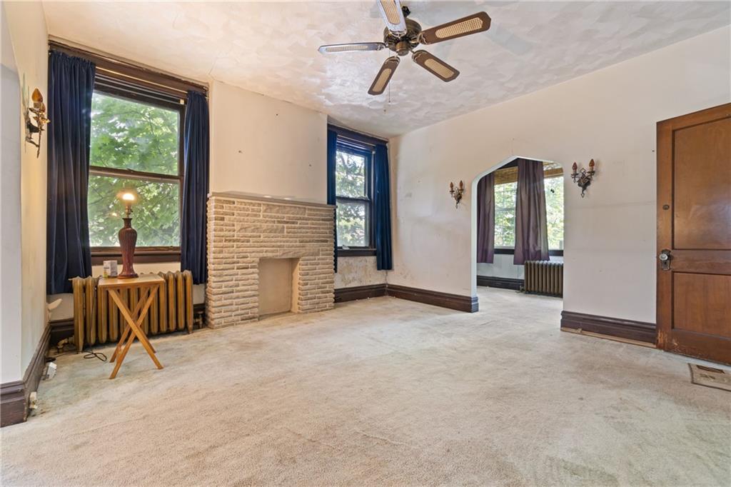 1300 Beechview Avenue Beechview, PA 15216 - Photo 6 of 31 a view of an empty room with a fireplace