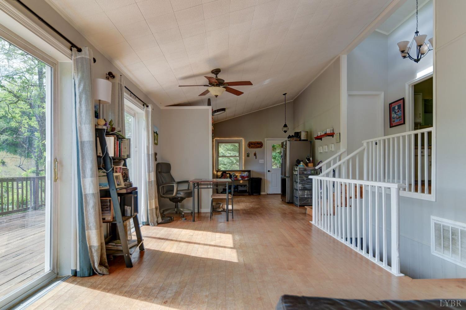 1112 Twinleaf Road Goode, VA 24556 - Photo 12 of 36 a view of hall way with furniture and windows