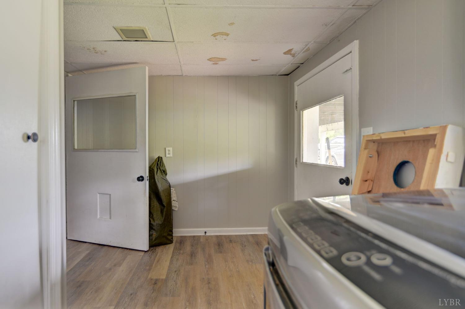 1112 Twinleaf Road Goode, VA 24556 - Photo 16 of 36 a bedroom with a bed and a mirror