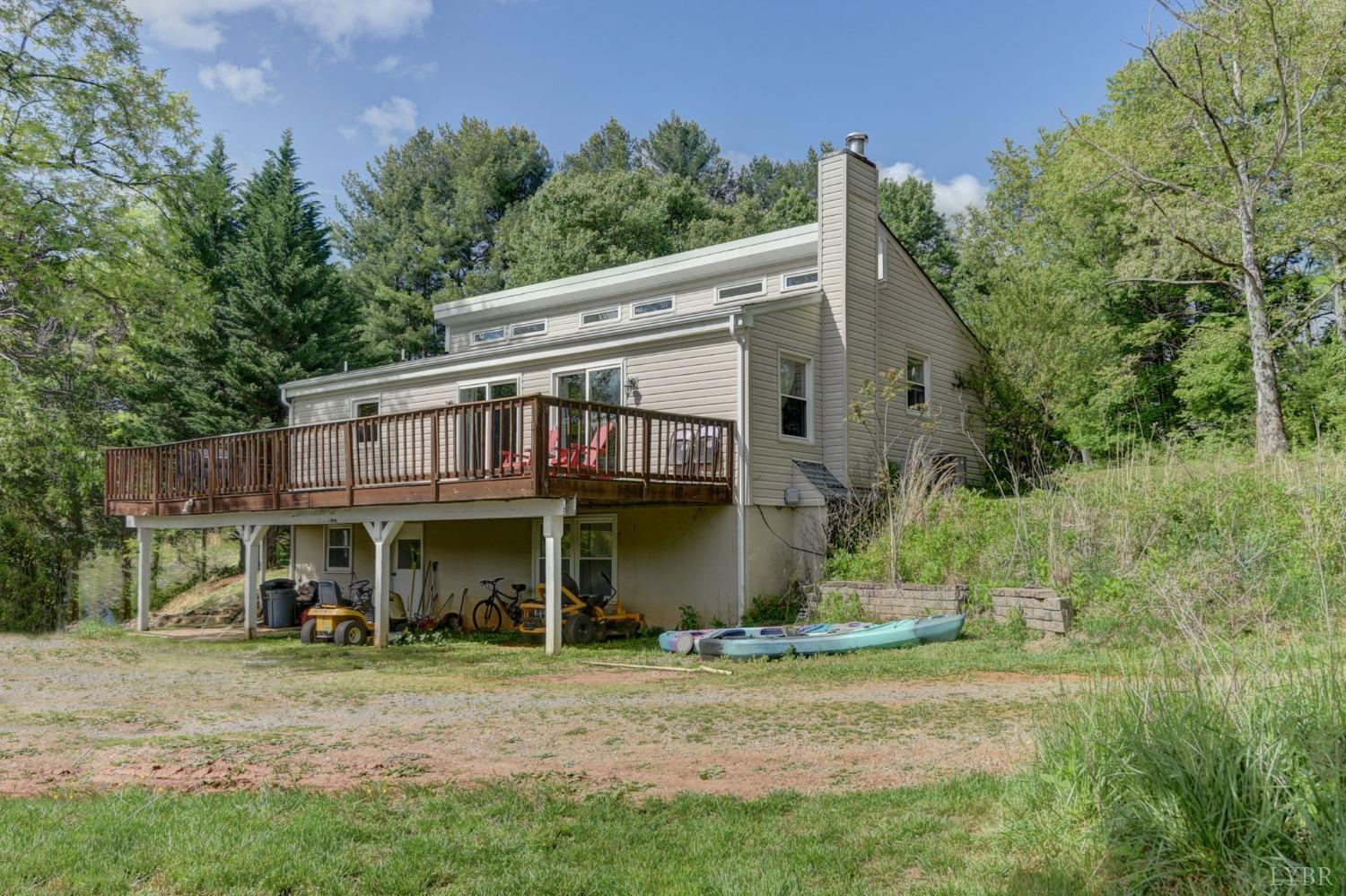 1112 Twinleaf Road Goode, VA 24556 - Photo 24 of 36 a view of an house with backyard space and balcony