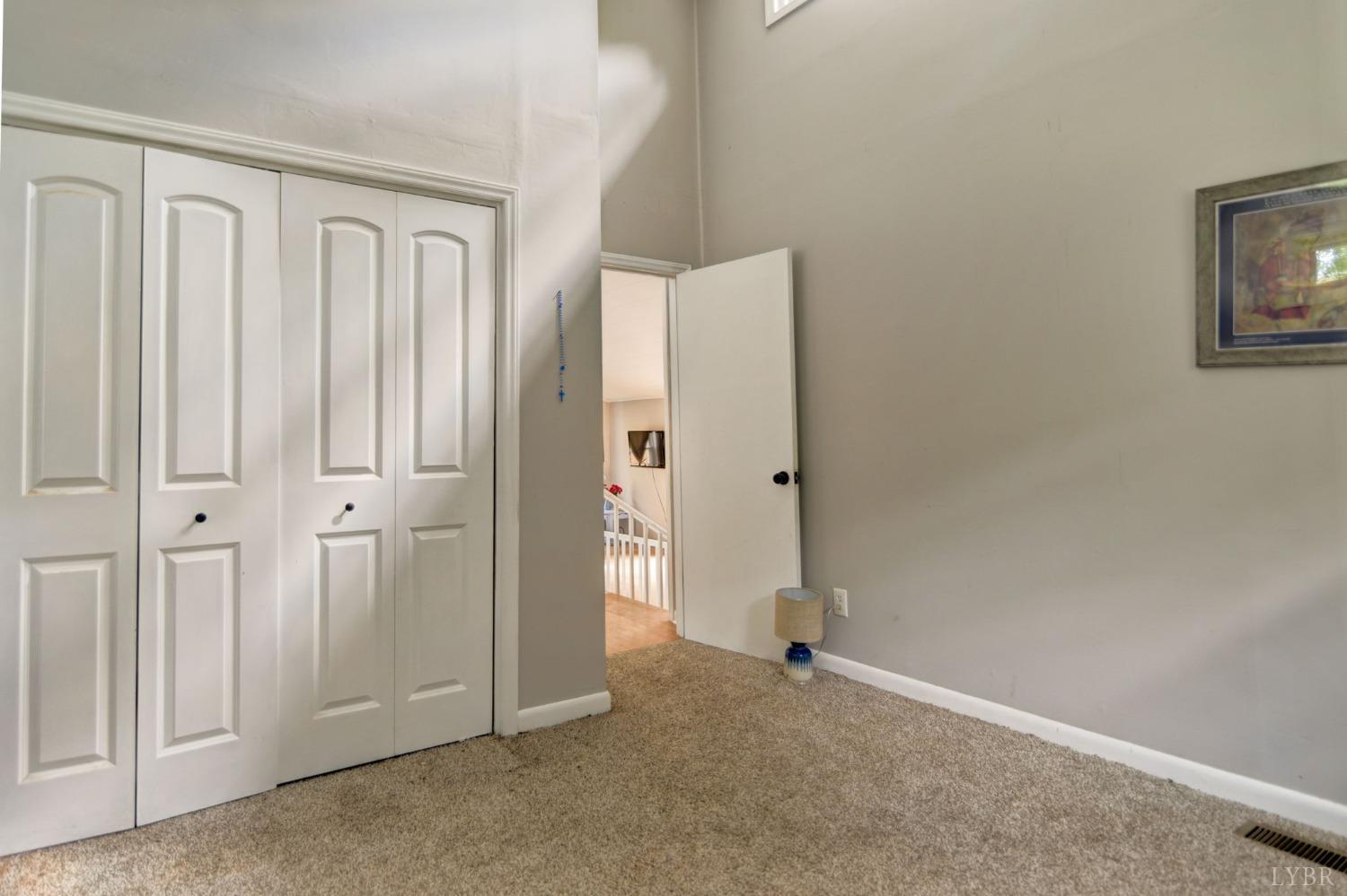 1112 Twinleaf Road Goode, VA 24556 - Photo 8 of 36 an empty room with windows