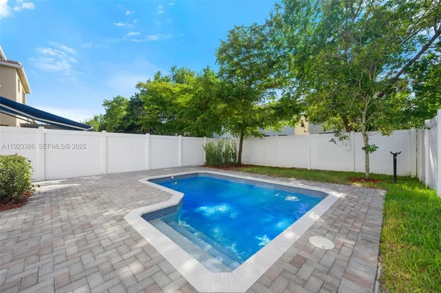 a view of an empty room with windows