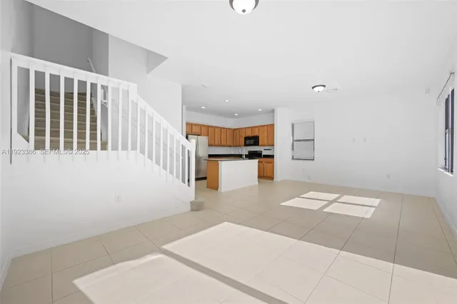 a view of kitchen with furniture and wooden floor
