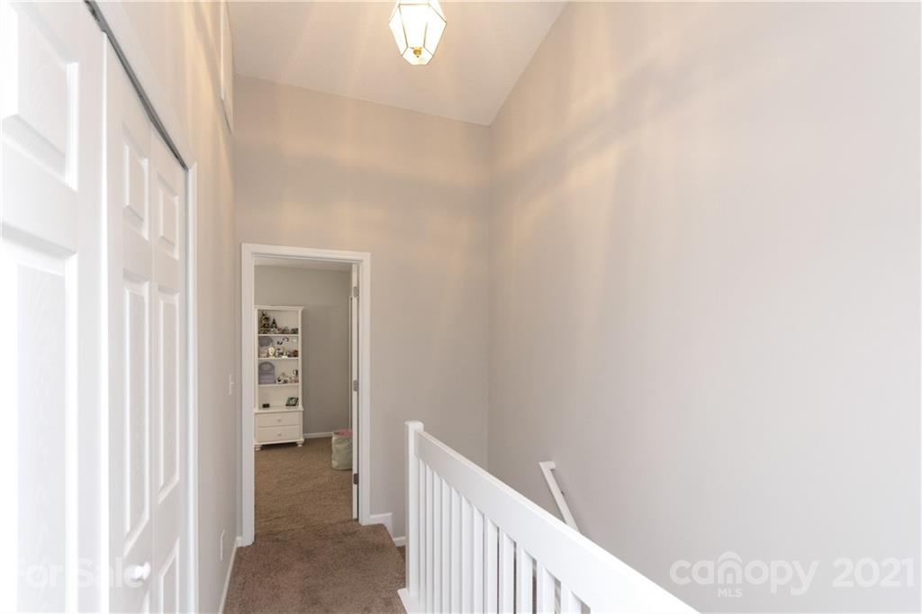8246 Rudolph Road Charlotte, NC 28216 - Photo 21 of 29 a view of a hallway with closet and bathroom