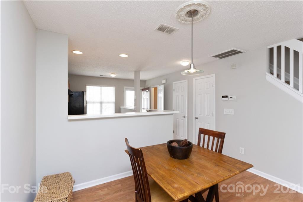 8246 Rudolph Road Charlotte, NC 28216 - Photo 9 of 29 a view of a dining room with furniture