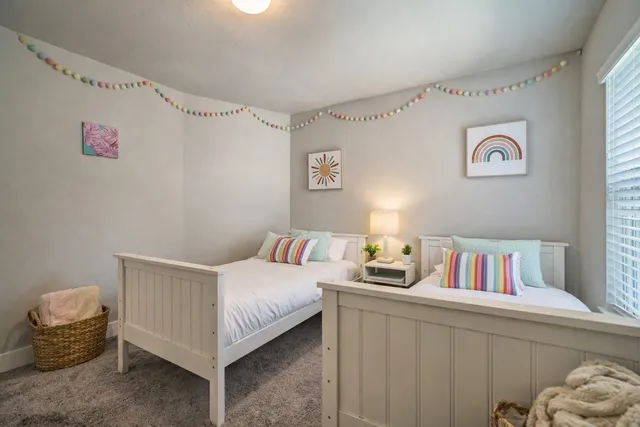 a bedroom with a bed and a table