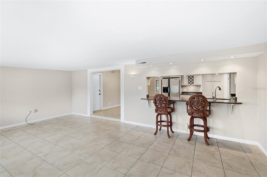 3452 Desoto Road Sarasota, FL 34235 - Photo 17 of 42 a view of a dining room with furniture and a chandelier