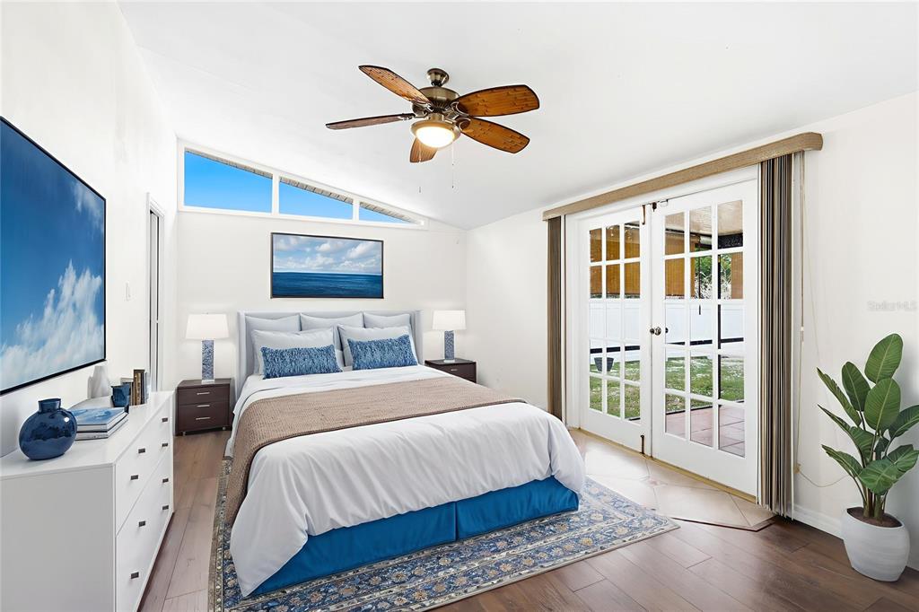 3452 Desoto Road Sarasota, FL 34235 - Photo 18 of 42 a bedroom with a bed and a large window