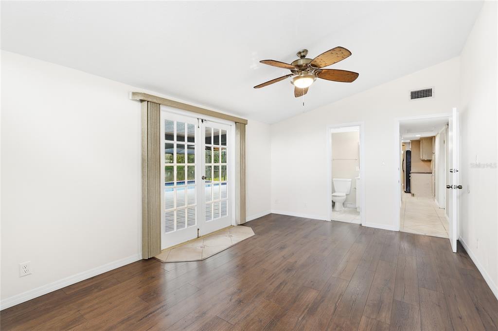 3452 Desoto Road Sarasota, FL 34235 - Photo 20 of 42 a view of empty room with wooden floor and fan
