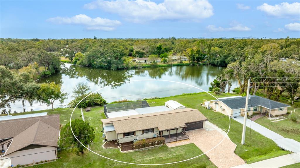 3452 Desoto Road Sarasota, FL 34235 - Photo 2 of 42 a view of a lake with a yard