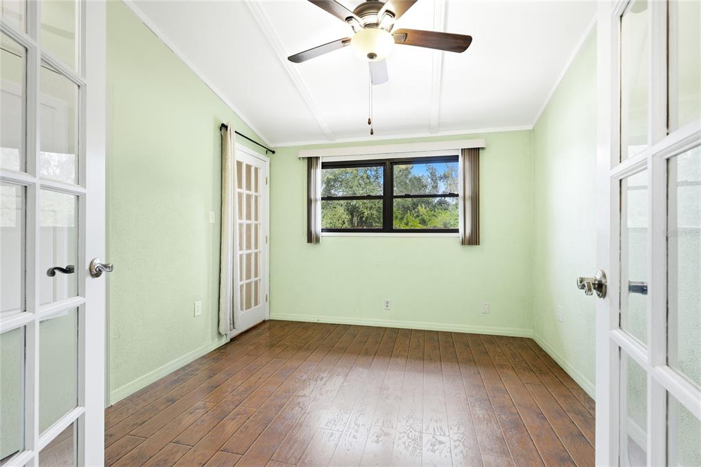 3452 Desoto Road Sarasota, FL 34235 - Photo 27 of 42 wooden floor in an empty room with a window