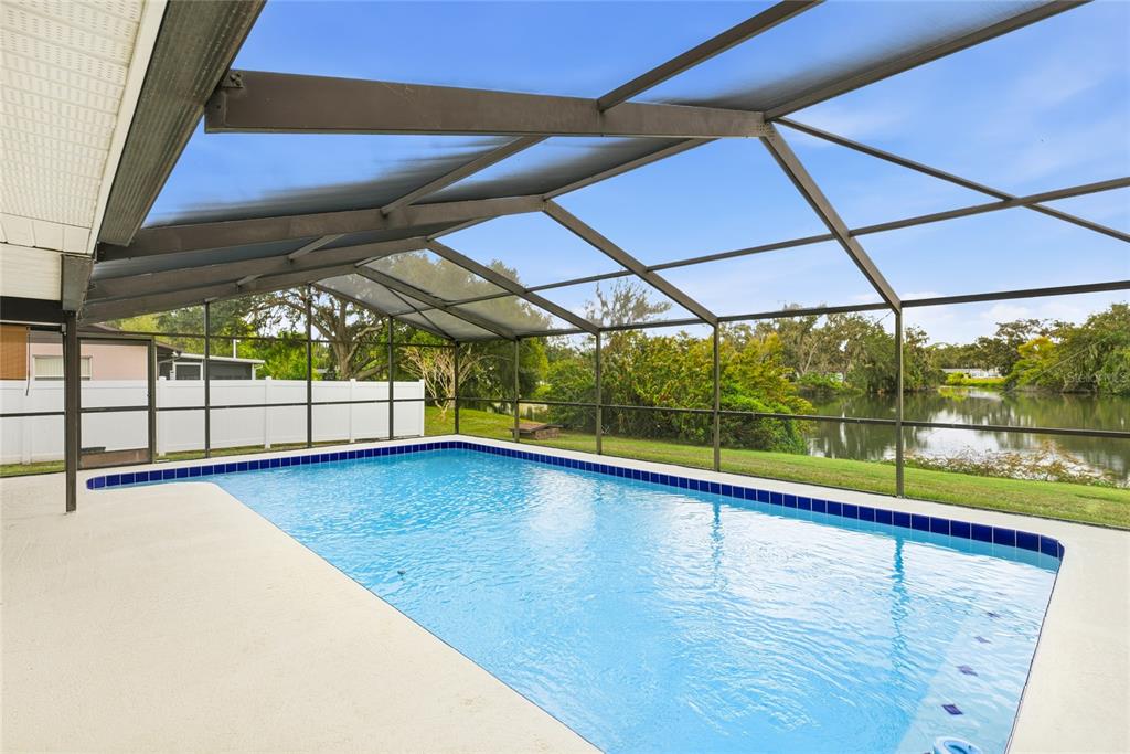 3452 Desoto Road Sarasota, FL 34235 - Photo 30 of 42 a view of empty room with wooden floor and door