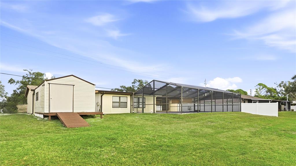 3452 Desoto Road Sarasota, FL 34235 - Photo 33 of 42 a view of a house with a big yard and large trees