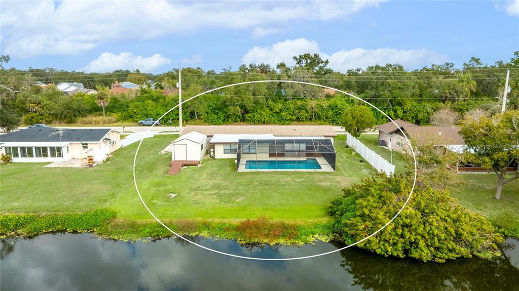 3452 Desoto Road Sarasota, FL 34235 - Photo 36 of 42 a view of a swimming pool with a yard