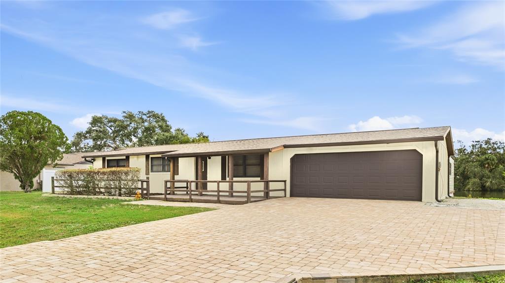 3452 Desoto Road Sarasota, FL 34235 - Photo 39 of 42 a front view of a house with a yard and garage