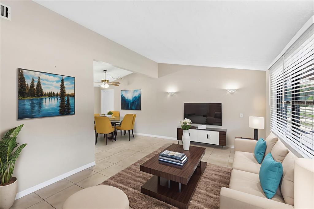 3452 Desoto Road Sarasota, FL 34235 - Photo 4 of 42 a living room with furniture and a flat screen tv