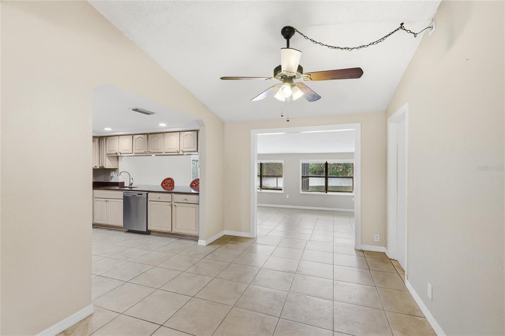 3452 Desoto Road Sarasota, FL 34235 - Photo 8 of 42 a view of a kitchen with furniture and a ceiling fan