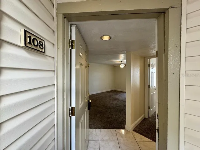 a view of a hallway with closet