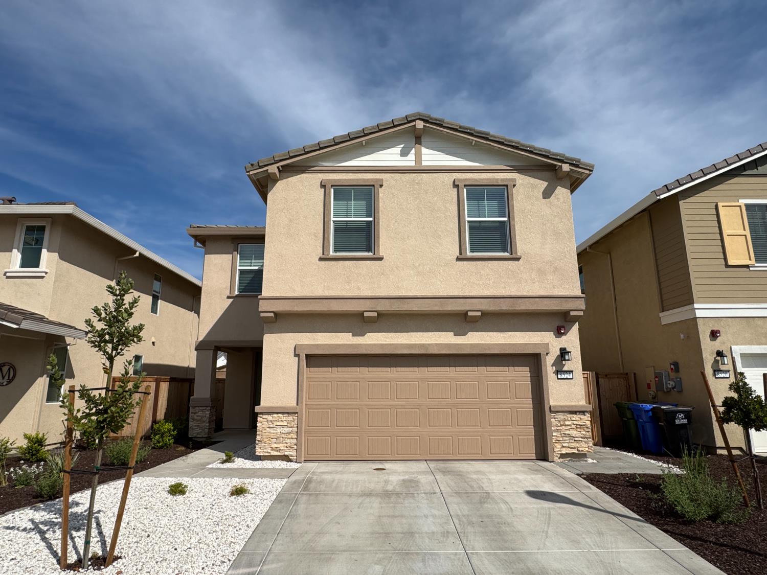 8524 Anker Way Elk Grove, CA 95757 - Photo 1 of 37 a front view of a house with a yard