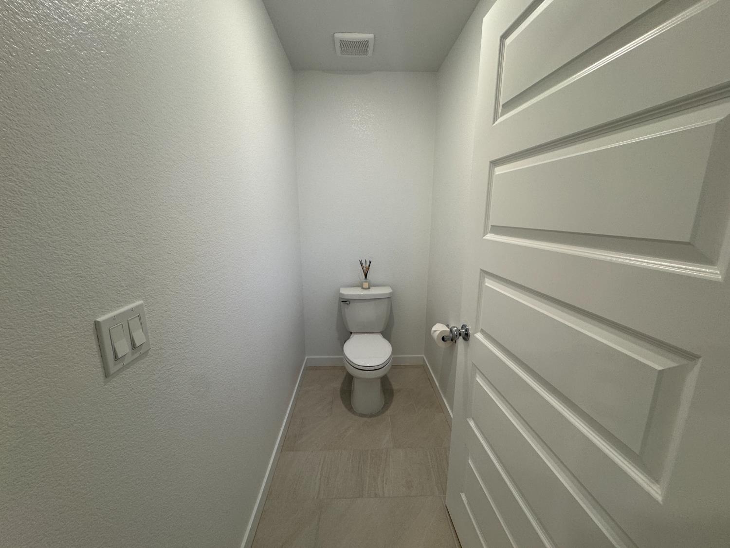 8524 Anker Way Elk Grove, CA 95757 - Photo 17 of 37 a bathroom with a toilet and a shower