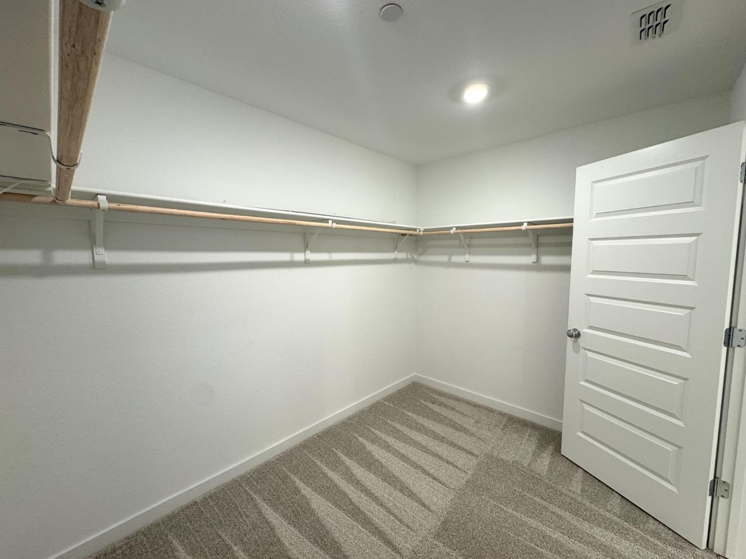 8524 Anker Way Elk Grove, CA 95757 - Photo 20 of 37 a view of walk in closet with empty racks
