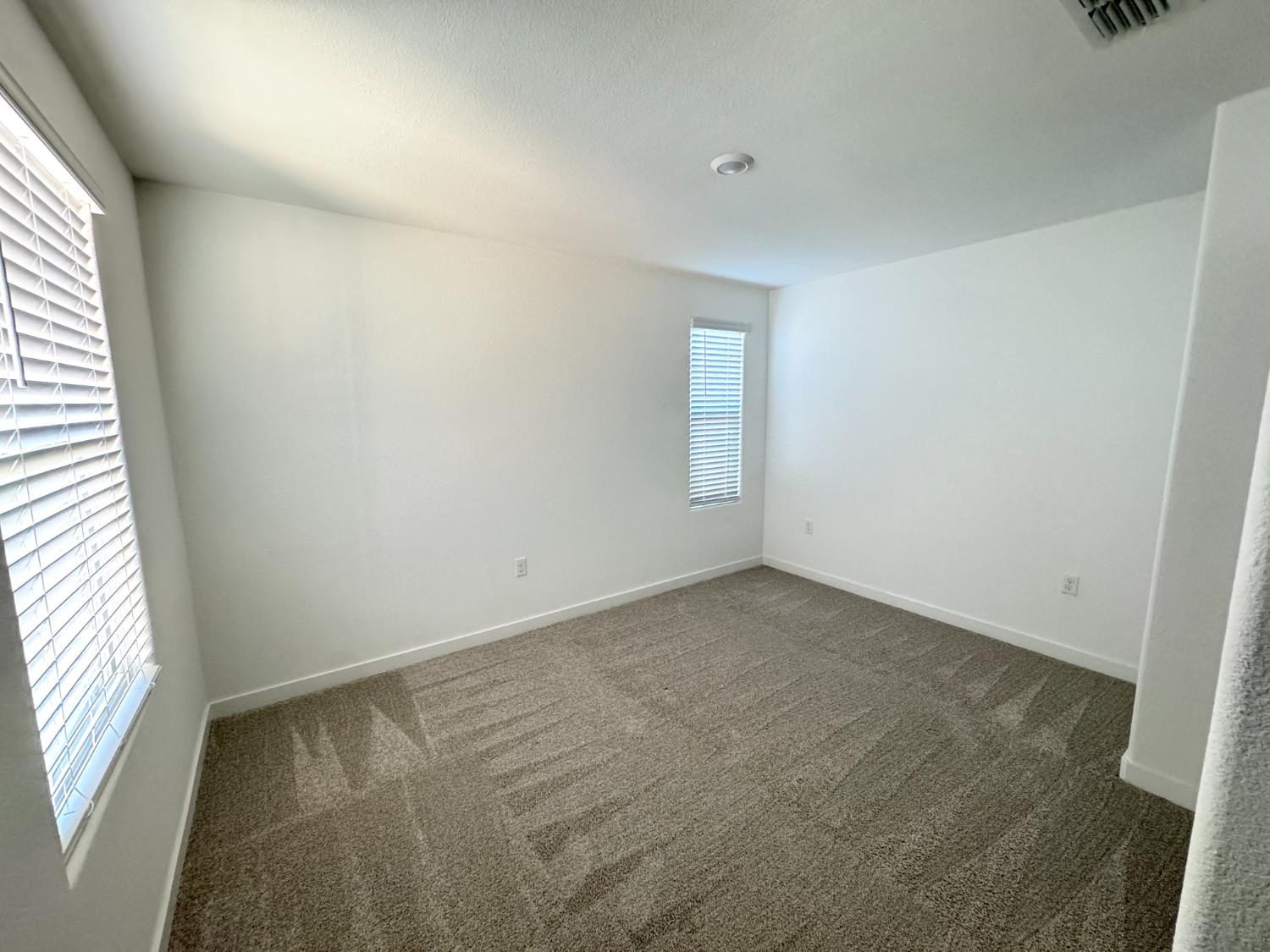 8524 Anker Way Elk Grove, CA 95757 - Photo 21 of 37 an empty room with windows