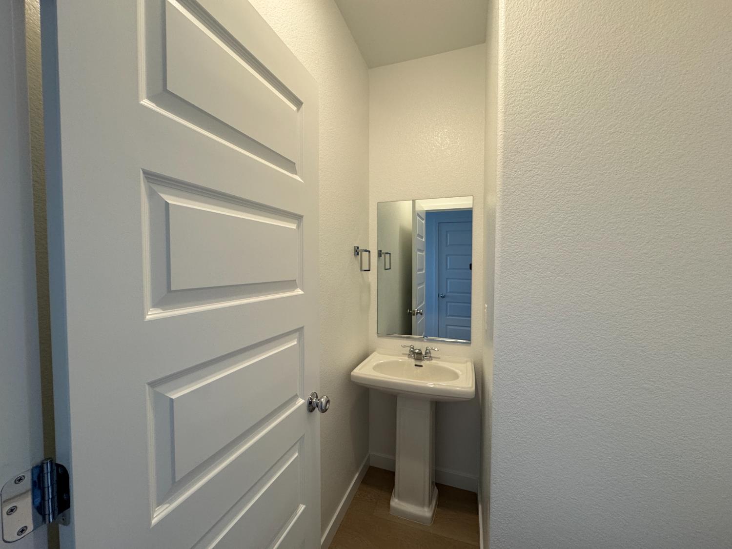 8524 Anker Way Elk Grove, CA 95757 - Photo 31 of 37 a bathroom with a sink toilet and mirror