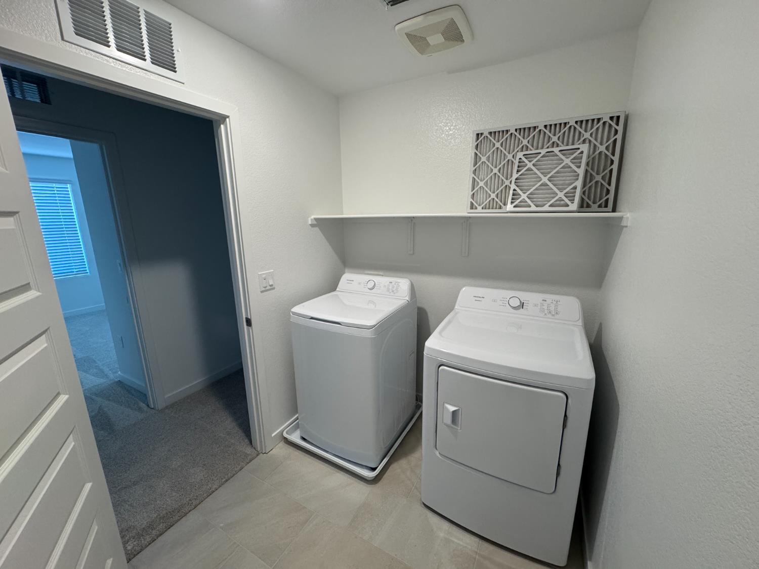 8524 Anker Way Elk Grove, CA 95757 - Photo 32 of 37 a utility room with dryer and washer