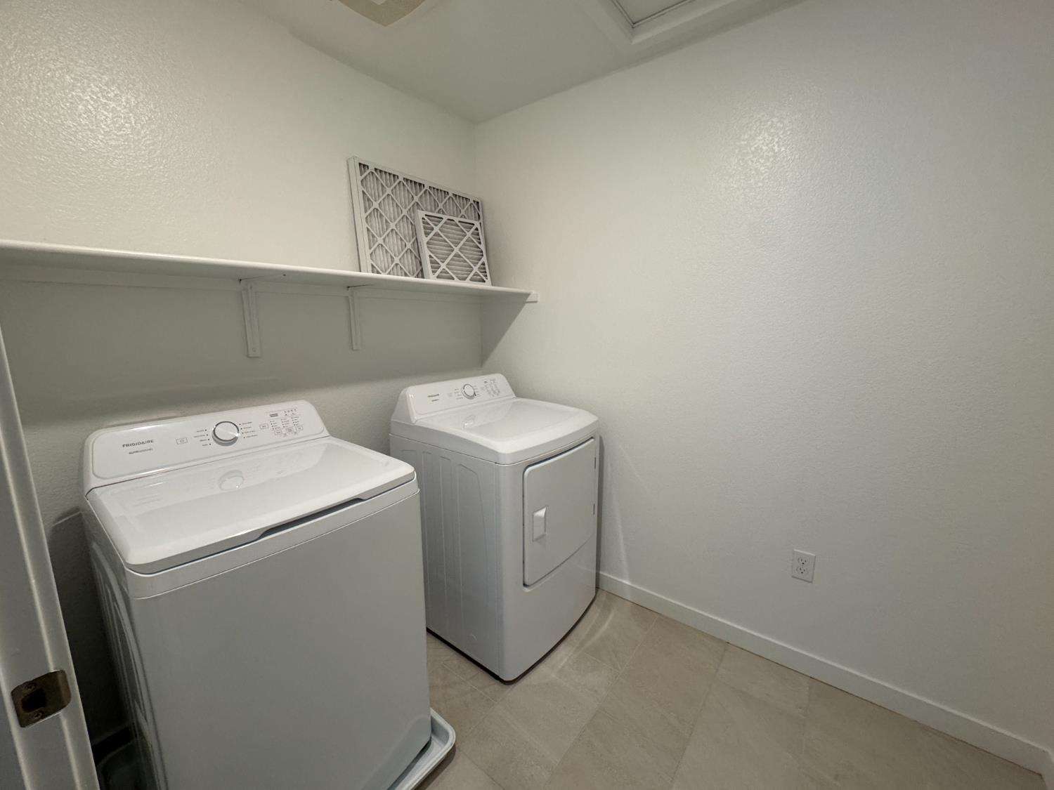 8524 Anker Way Elk Grove, CA 95757 - Photo 34 of 37 a utility room with dryer and washer