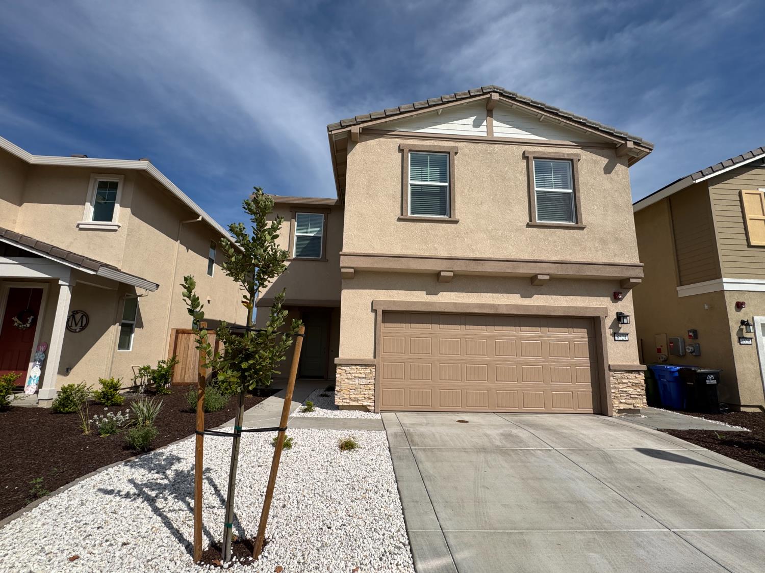 8524 Anker Way Elk Grove, CA 95757 - Photo 5 of 37 a front view of a house with garden