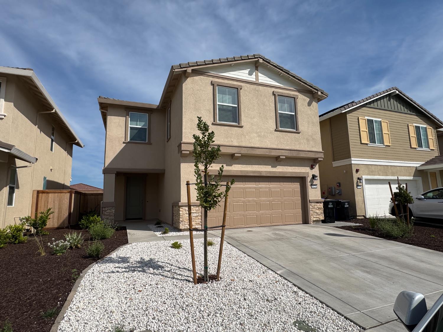 8524 Anker Way Elk Grove, CA 95757 - Photo 6 of 37 a front view of a house with a yard