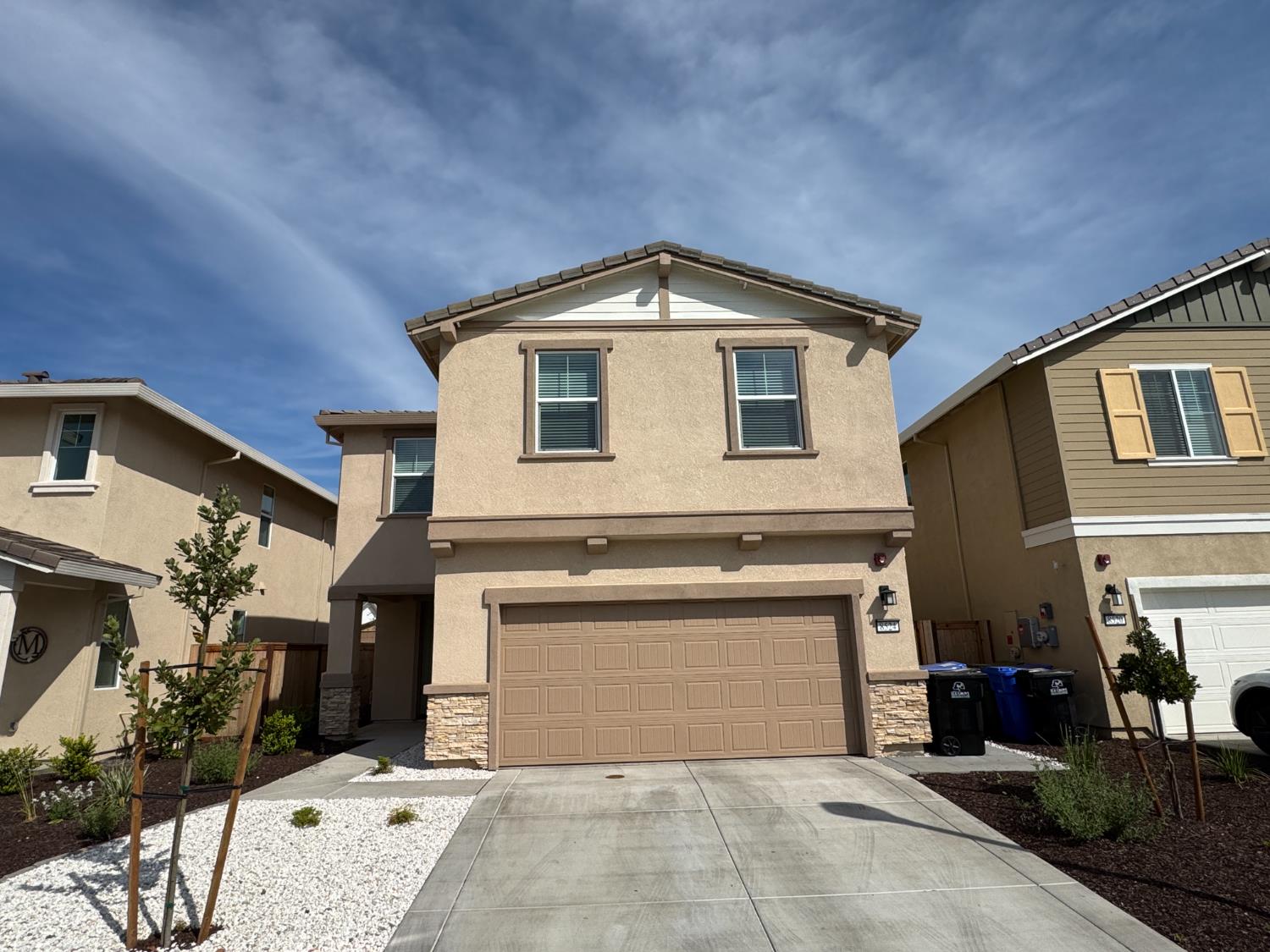 8524 Anker Way Elk Grove, CA 95757 - Photo 8 of 37 a front view of a house with a yard