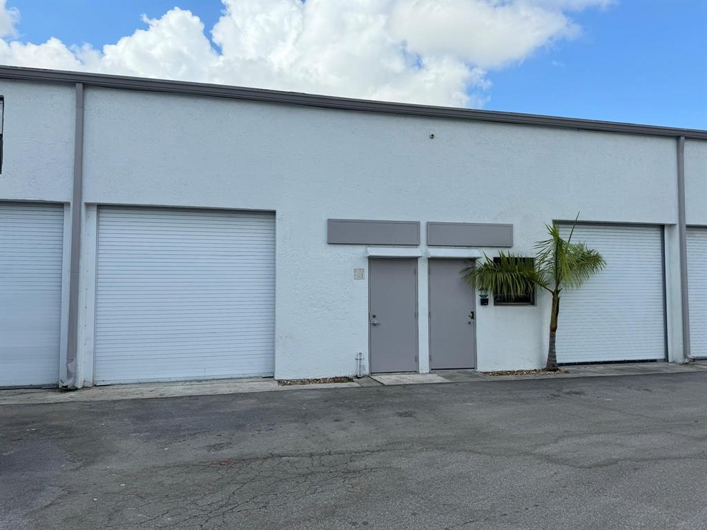 1773 Blount Road, Unit 313 Pompano Beach, FL 33069 - Photo 1 of 8 a view of a garage