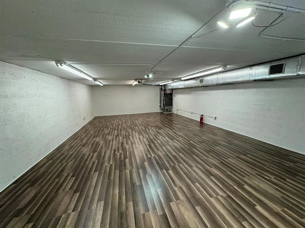 1773 Blount Road, Unit 313 Pompano Beach, FL 33069 - Photo 2 of 8 a view of a room with wooden floor