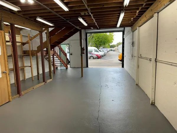 a view of an empty room with a balcony