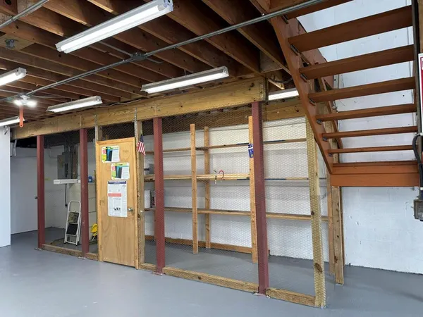 a view of a hallway with stairs