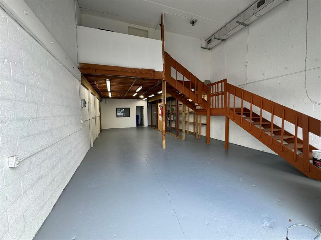 1773 Blount Road, Unit 313 Pompano Beach, FL 33069 - Photo 8 of 8 a view of a hallway with stairs