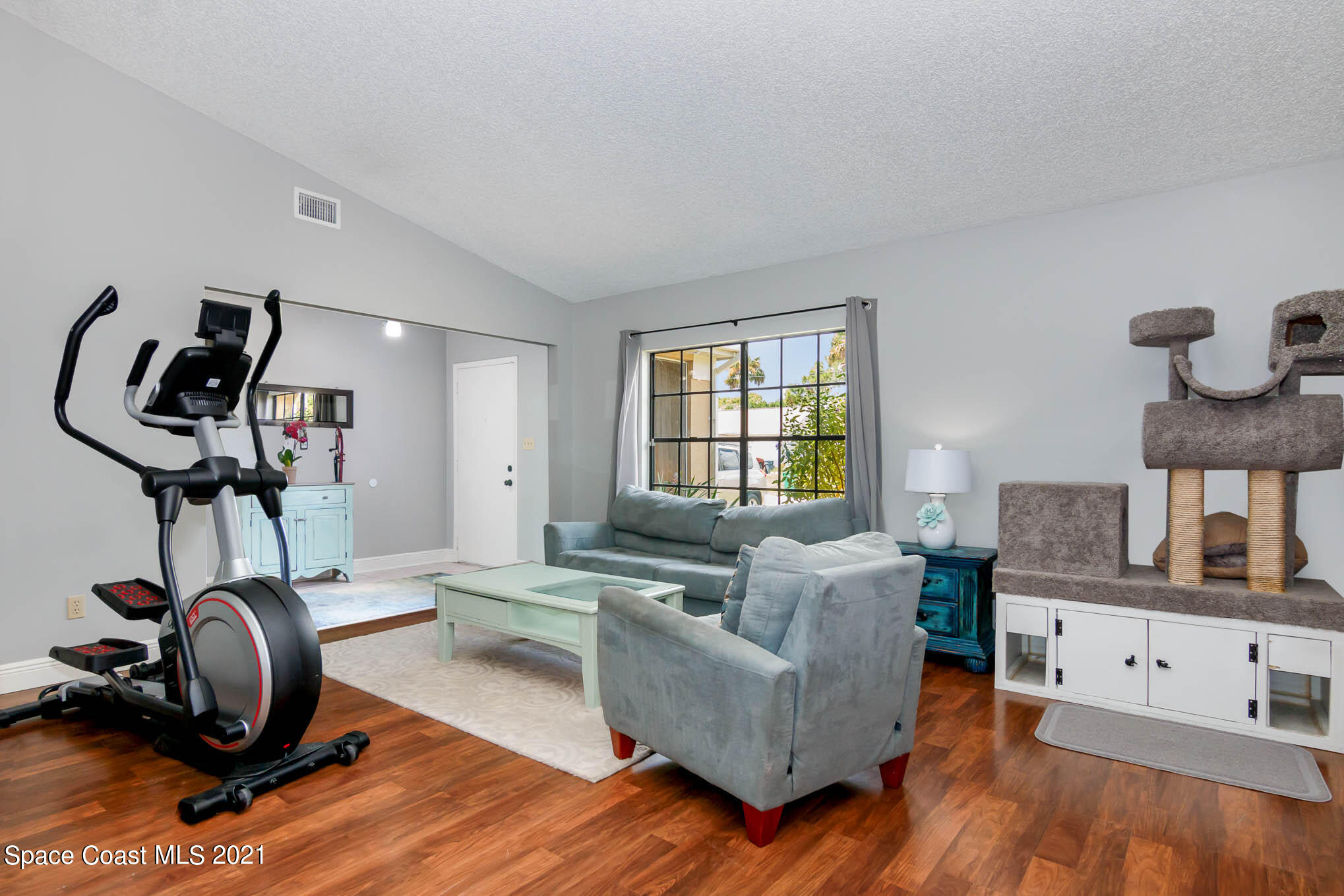5617 Flint Road Cocoa, FL 32927 - Photo 17 of 25 a living room with furniture and a wooden floor