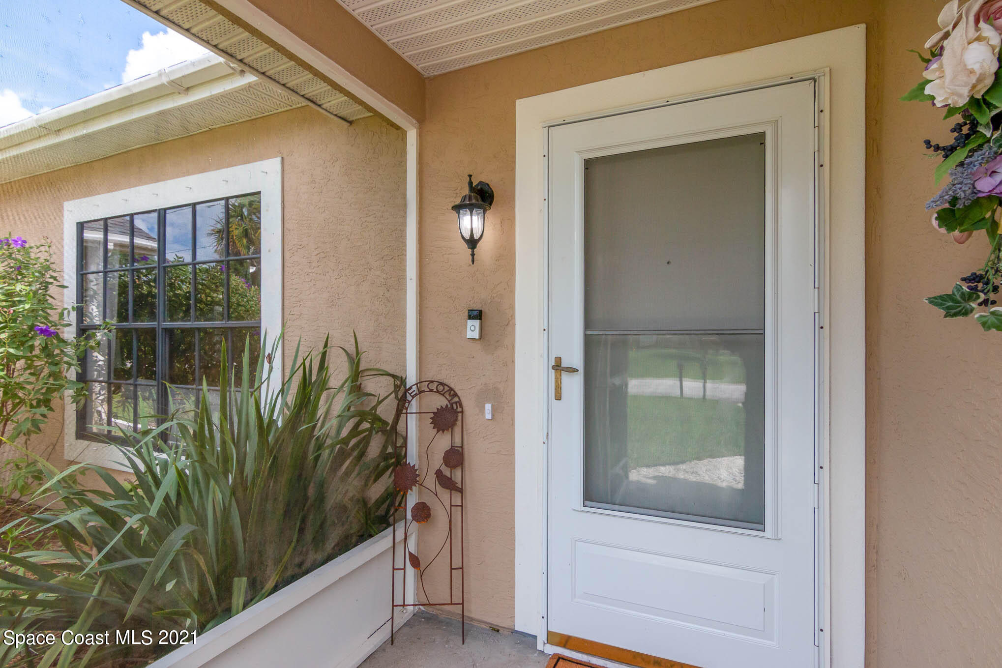5617 Flint Road Cocoa, FL 32927 - Photo 3 of 25 a view of a glass door of a house