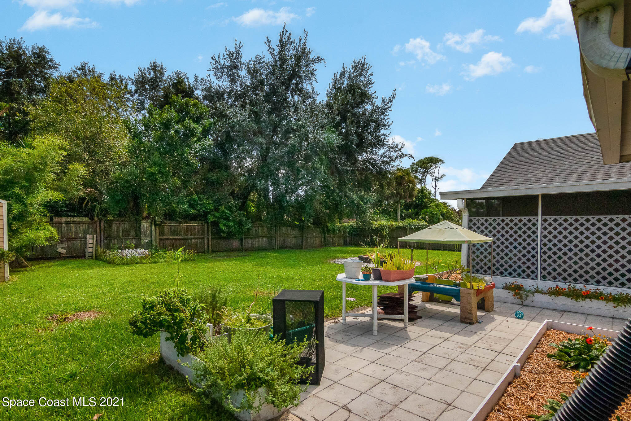 5617 Flint Road Cocoa, FL 32927 - Photo 23 of 25 a view of a chair and table on the garden