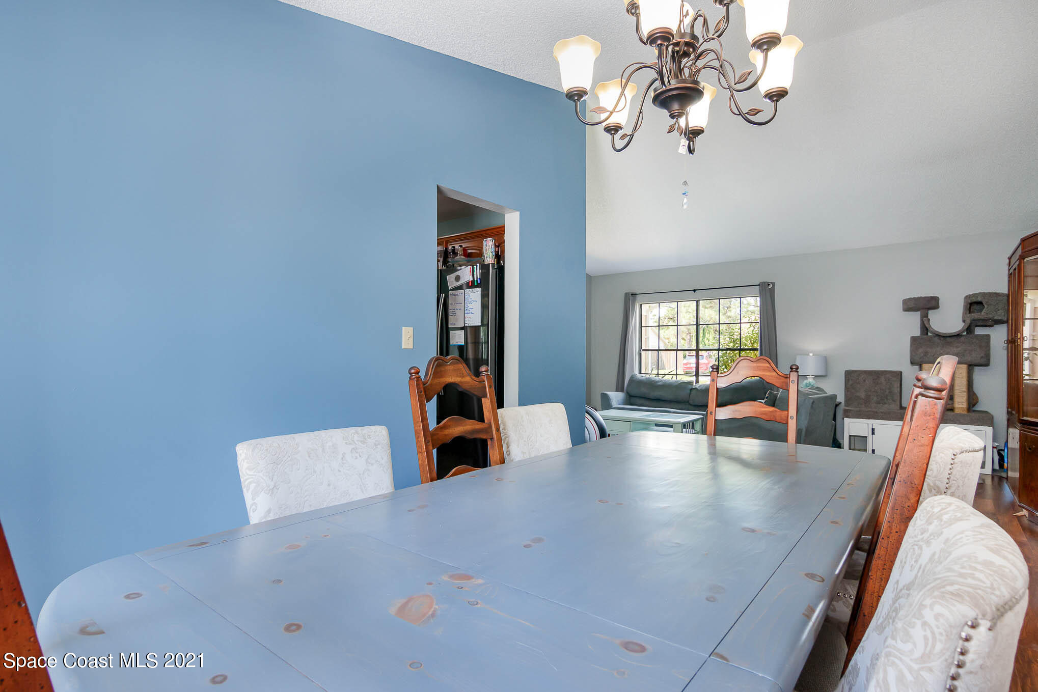 5617 Flint Road Cocoa, FL 32927 - Photo 10 of 25 a view of a dining room with furniture and wooden floor