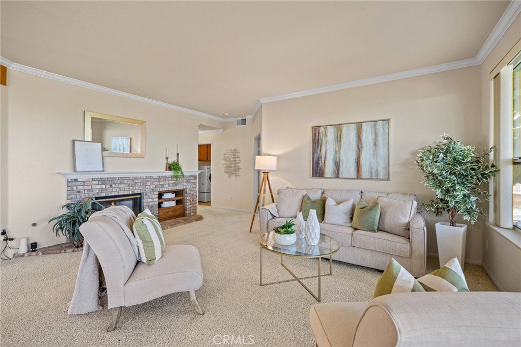 5118 Avenida De La Plata Oceanside, CA 92057 - Photo 16 of 42 a living room with furniture a fireplace and a potted plant