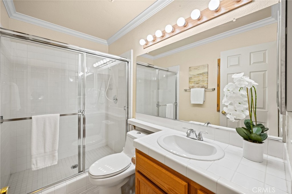 5118 Avenida De La Plata Oceanside, CA 92057 - Photo 19 of 42 a bathroom with a sink a toilet and shower