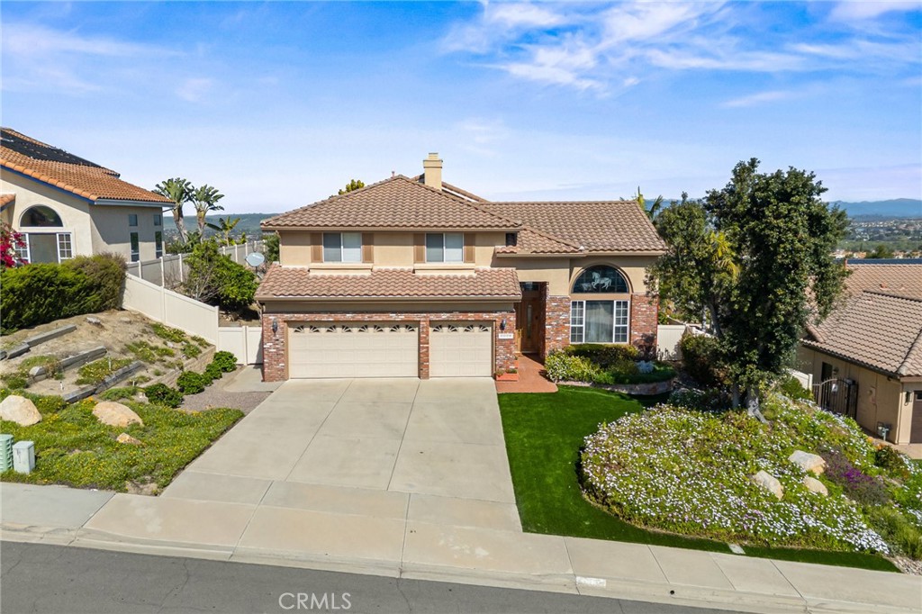 5118 Avenida De La Plata Oceanside, CA 92057 - Photo 2 of 42 a front view of a house with a yard