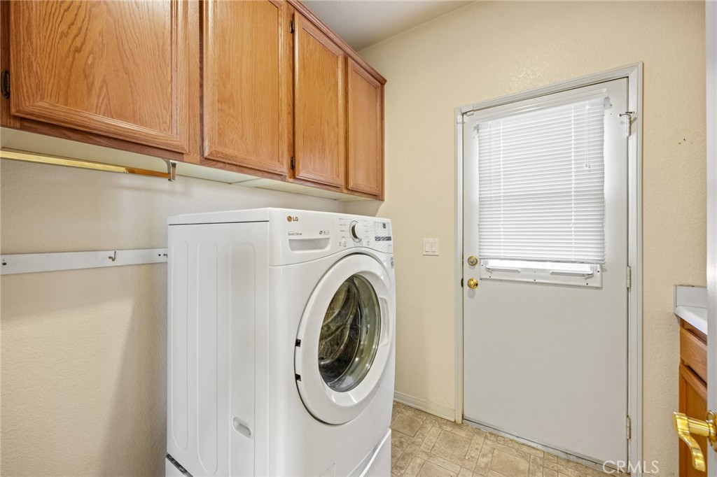 5118 Avenida De La Plata Oceanside, CA 92057 - Photo 30 of 42 a utility room with dryer and washer