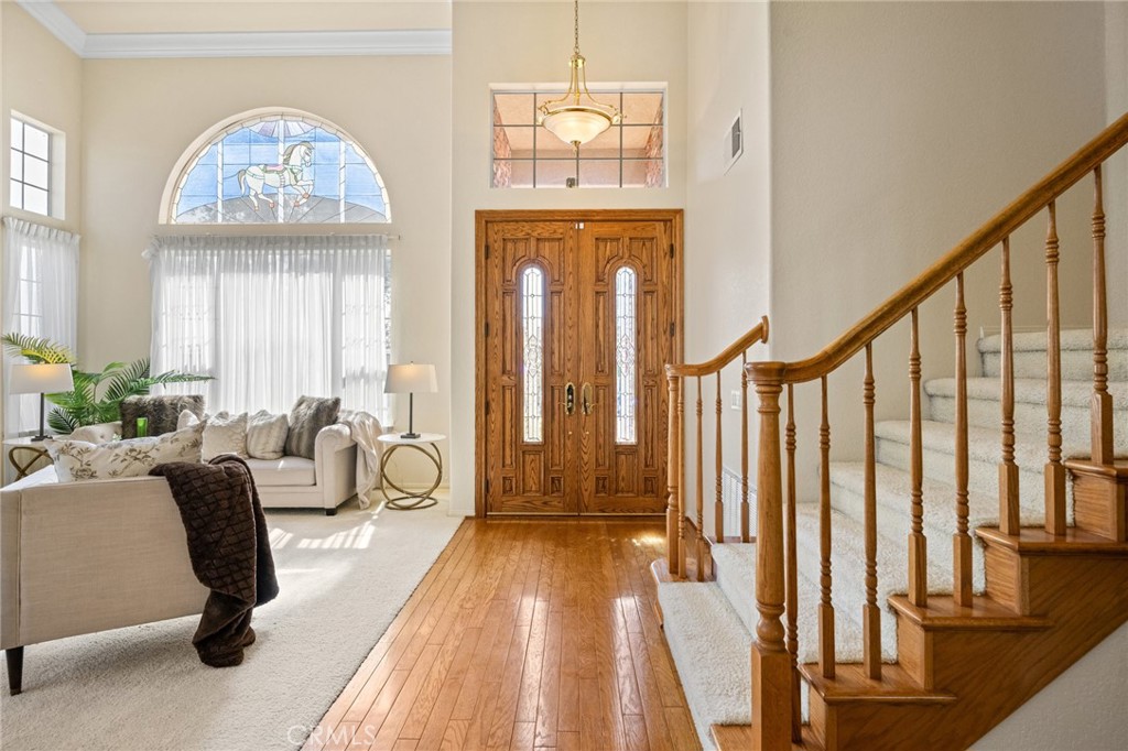 5118 Avenida De La Plata Oceanside, CA 92057 - Photo 3 of 42 a very nice looking room with a large windows and a chandelier