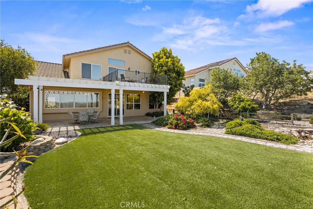 5118 Avenida De La Plata Oceanside, CA 92057 - Photo 31 of 42 a front view of house with yard and outdoor seating
