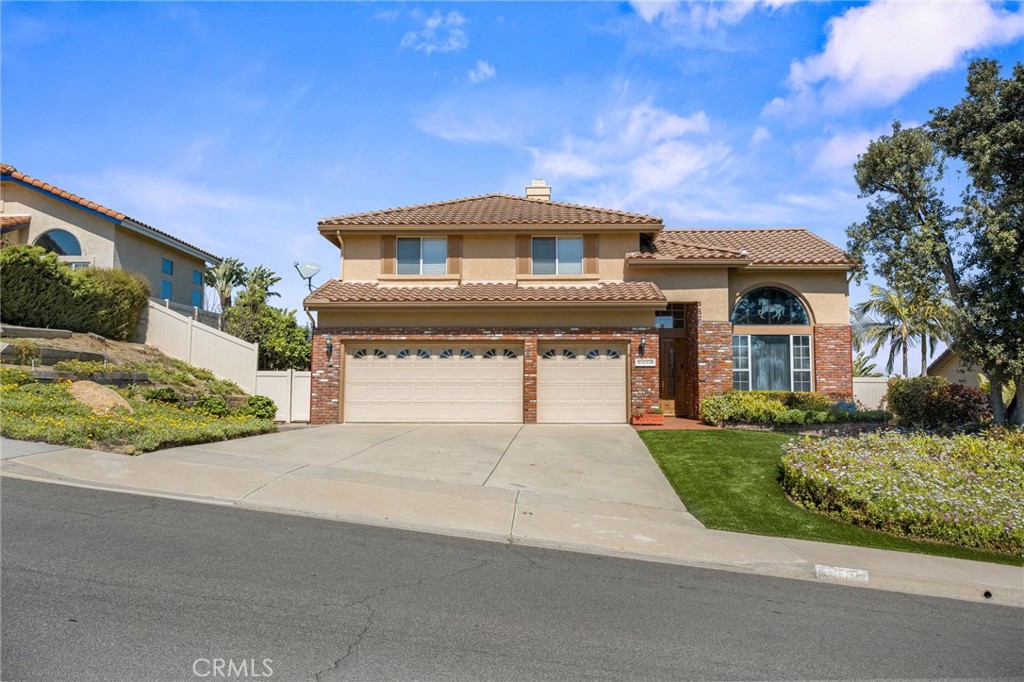 5118 Avenida De La Plata Oceanside, CA 92057 - Photo 39 of 42 a front view of a house with a garden
