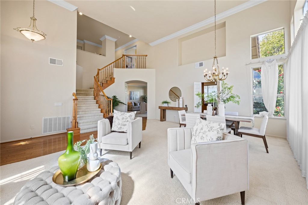 5118 Avenida De La Plata Oceanside, CA 92057 - Photo 6 of 42 a living room with furniture fireplace and a chandelier