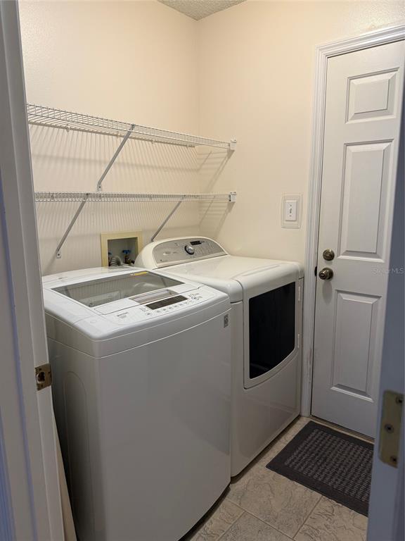 4501 River Ridge Drive Leesburg, FL 34748 - Photo 8 of 16 a utility room with dryer and washer